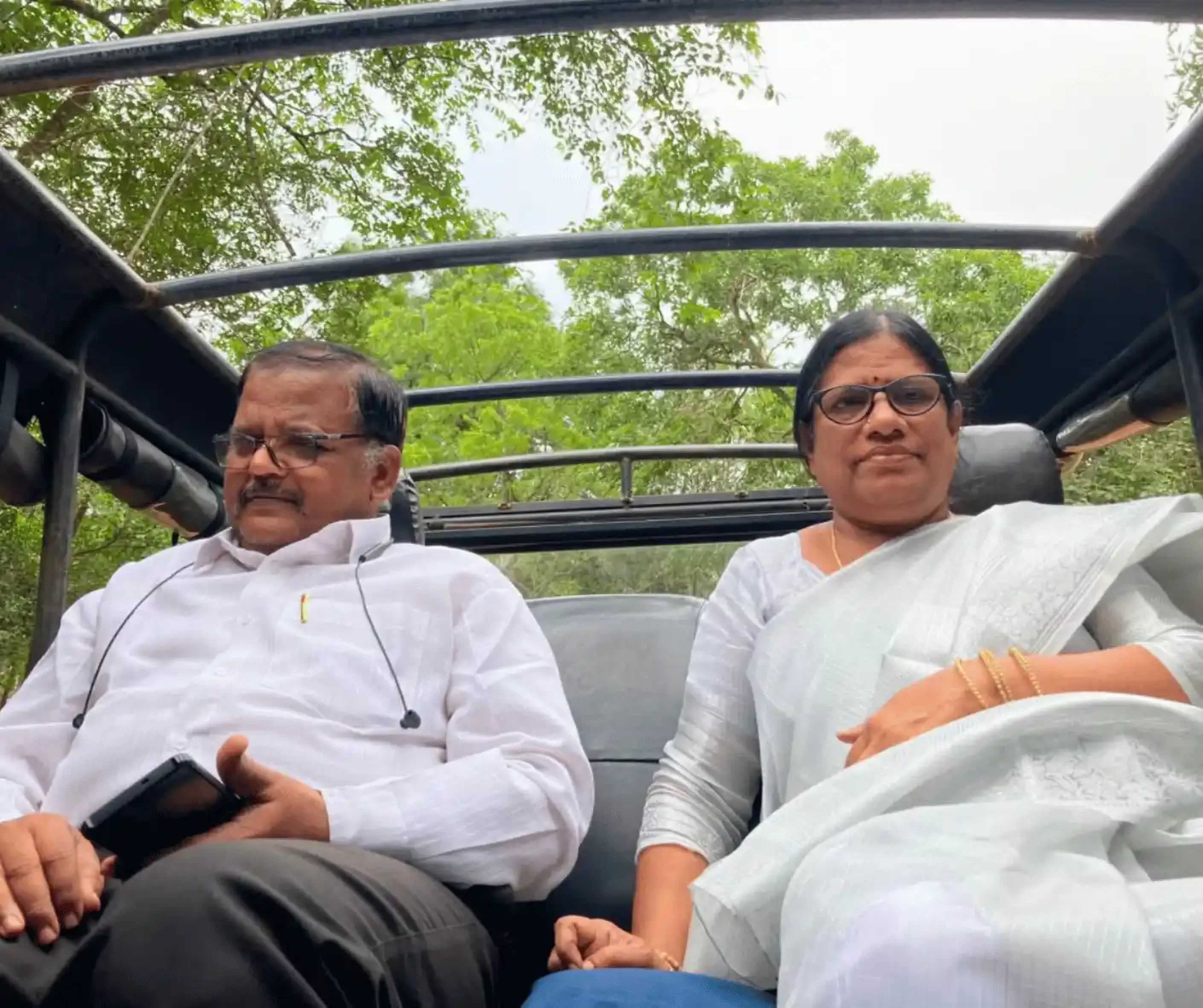 tourist travel couple from india traveling sri lanka trip with driver and guide with car in elephant jeep safari
