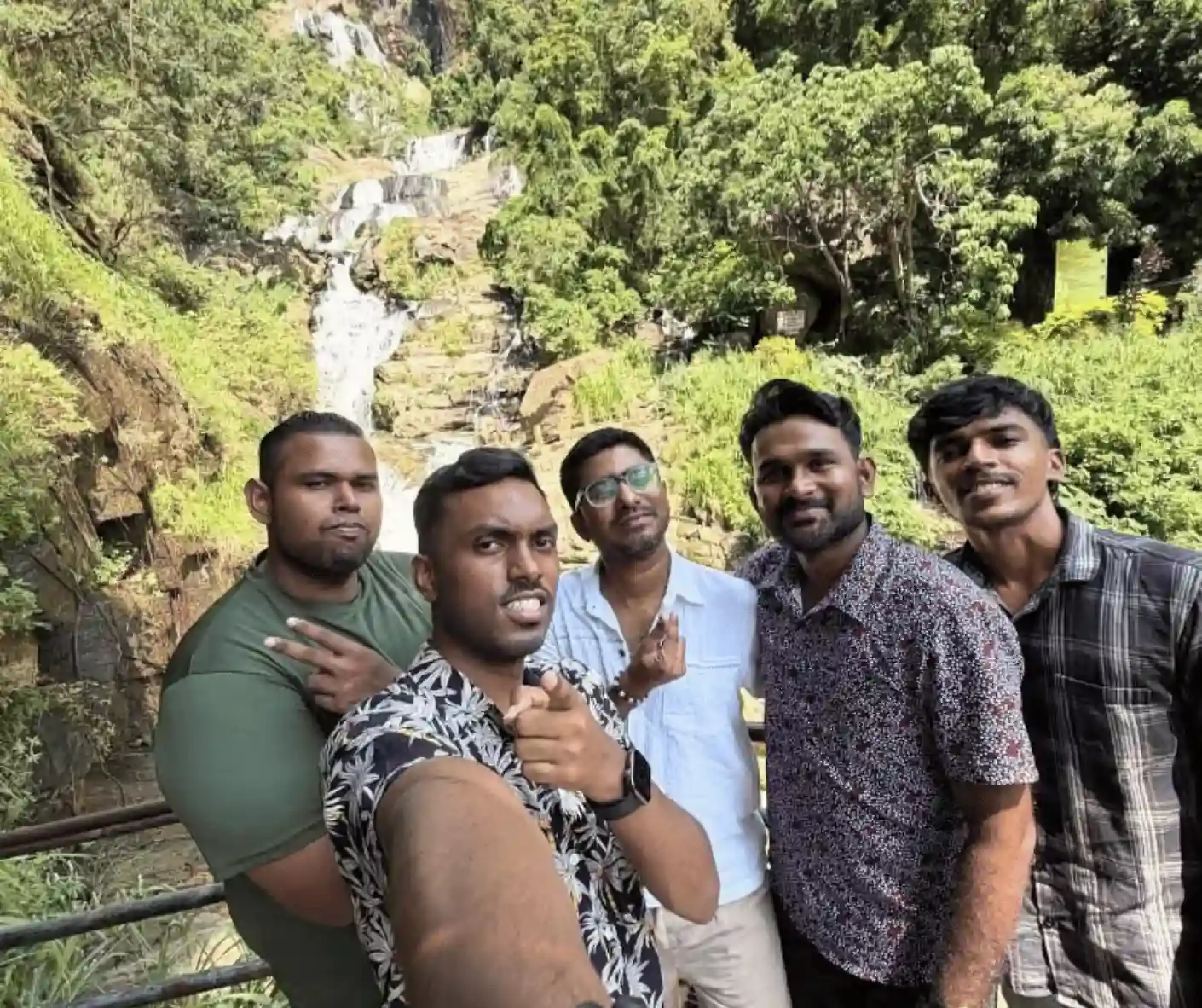 tourist travel friend group from malaysia traveling sri lanka trip with driver and guide with car in ravana ella waterfall in ella