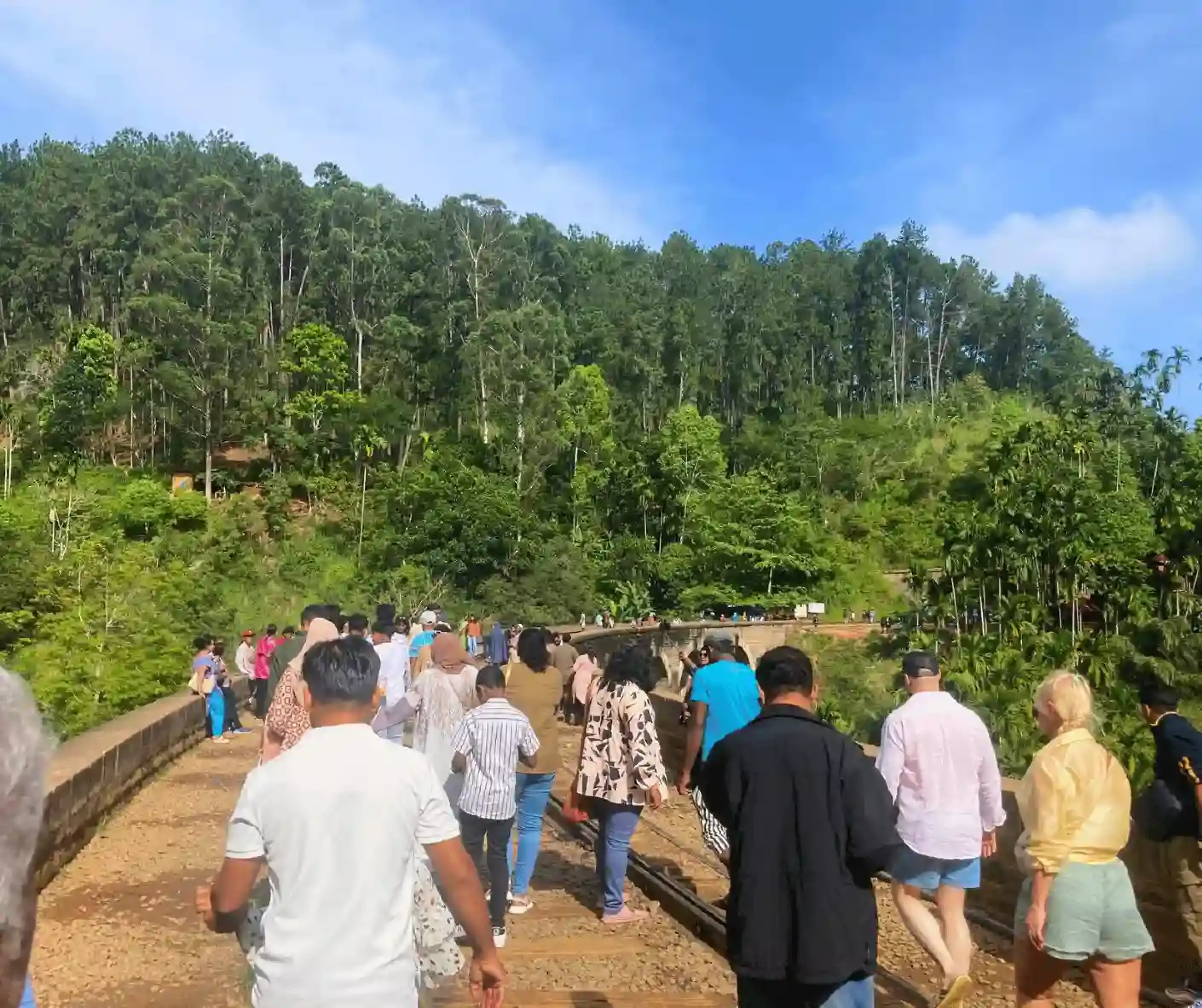 tourist travel group from malaysia traveling sri lanka trip with driver and guide in ella nine arch bridge view point