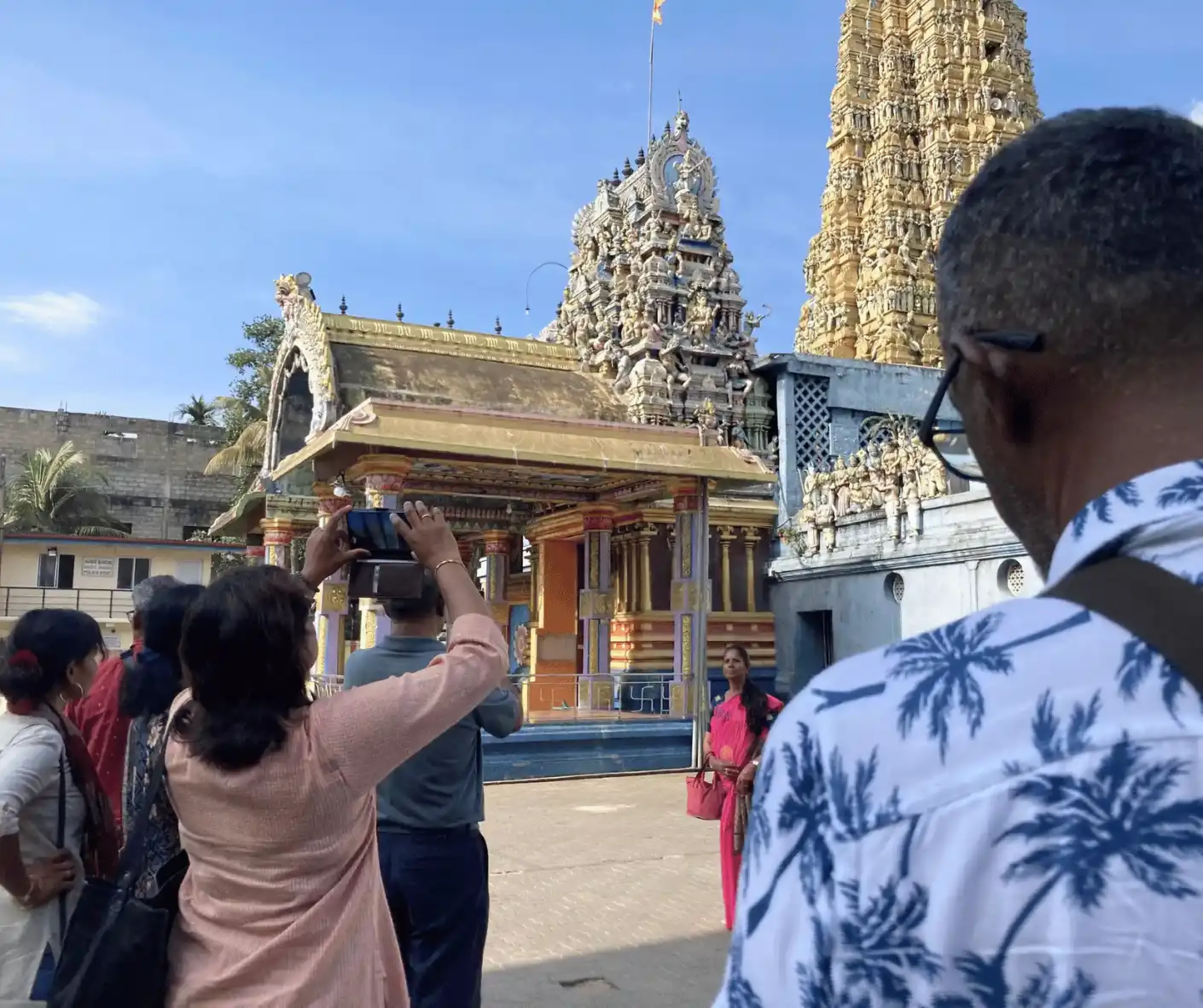 tourist travel group from malaysia traveling sri lanka trip with driver and guide in hindu temple in matale sri lanka