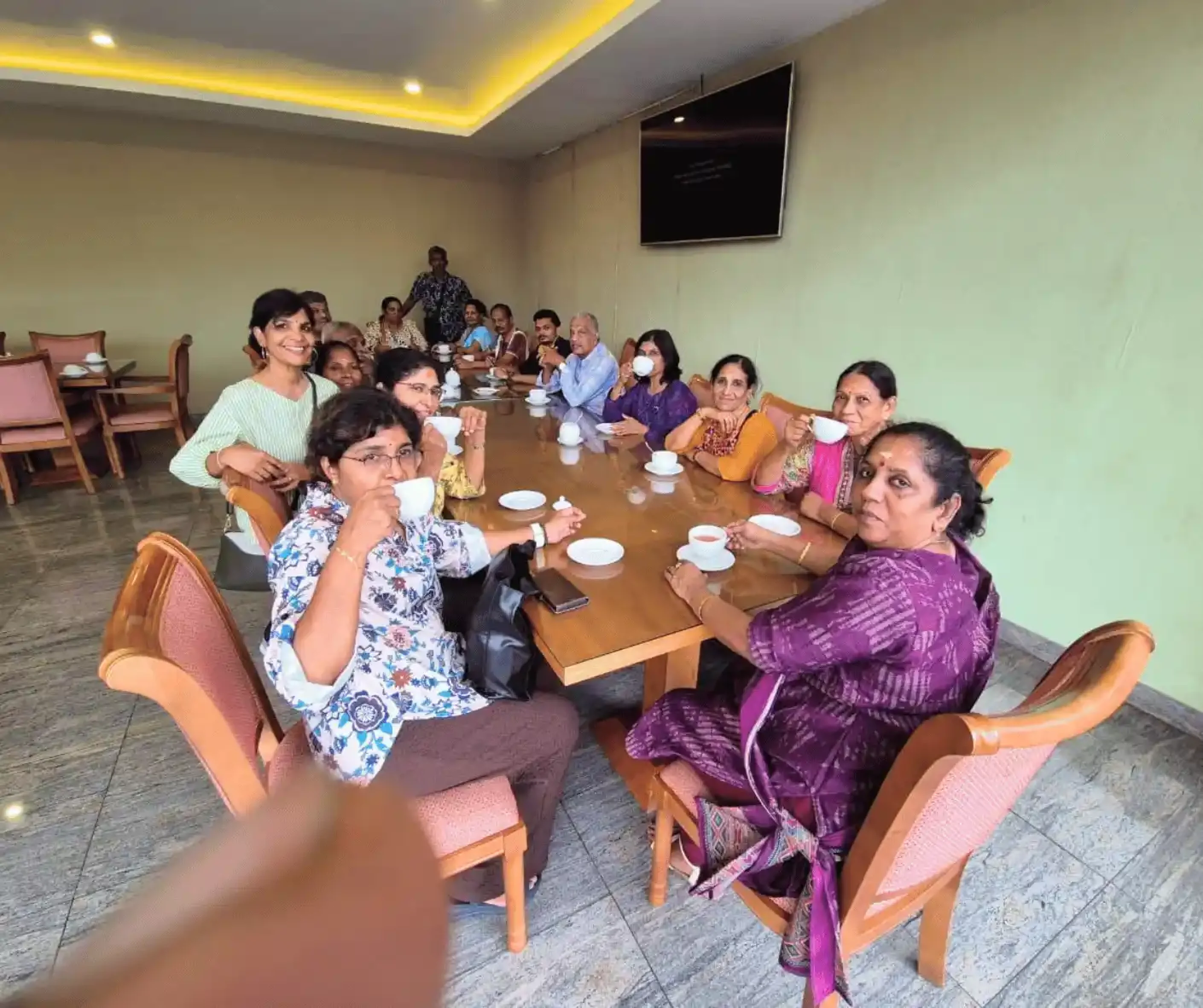 tourist travel group from malaysia traveling sri lanka trip with driver and guide in labookelie tea factory in nuwara eliya